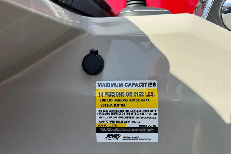 Slide: The Image of 2025 Barletta LUSSO 25UCAT capacity label, 14 persons or 2162 lbs, 900 HP motor. - 32