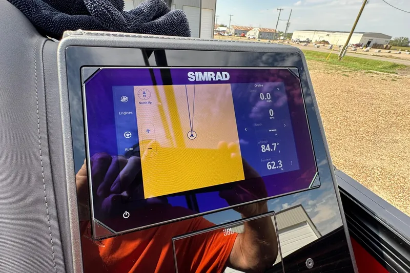 Slide: The Image of Simrad display on 2025 Barletta LUSSO 25UCAT showing navigation and engine data. - 34