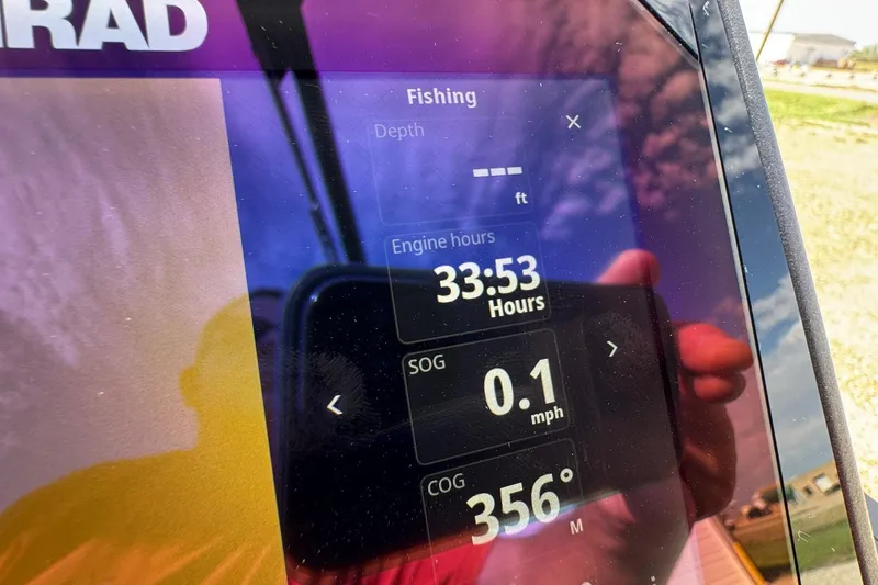 Slide: The Image of Display screen showing fishing data on a 2025 Barletta LUSSO 25UCAT boat. - 35
