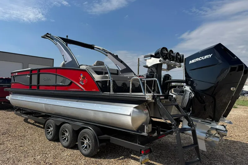 Slide: The Image of 2025 Barletta LUSSO 25UCAT pontoon boat with Mercury engine on a trailer. - 7