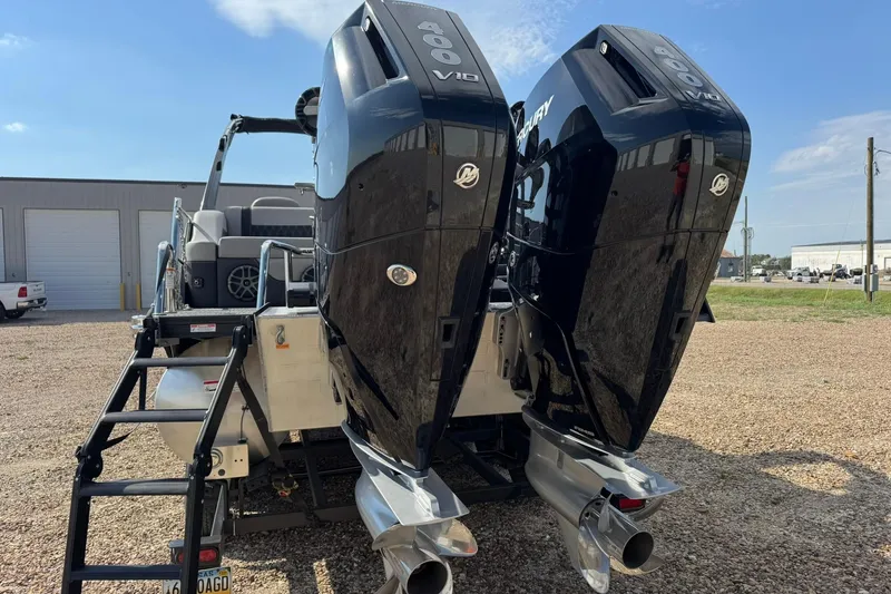 Slide: The Image of 2025 Barletta LUSSO 25UCAT with dual Mercury V10 outboard engines, rear view. - 9