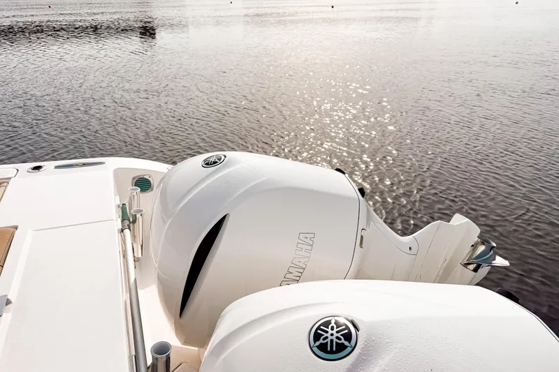 Slide: The Image of 2016 Pursuit OS 355 Offshore boat with Yamaha outboard engines on calm water. - 10