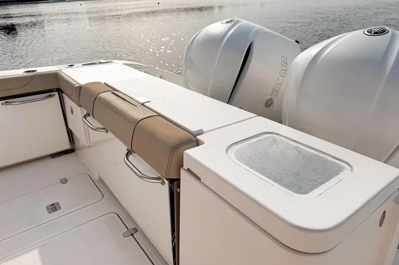 Slide: The Image of 2016 Pursuit OS 355 Offshore boat with Yamaha engines, featuring a sleek deck design. - 11