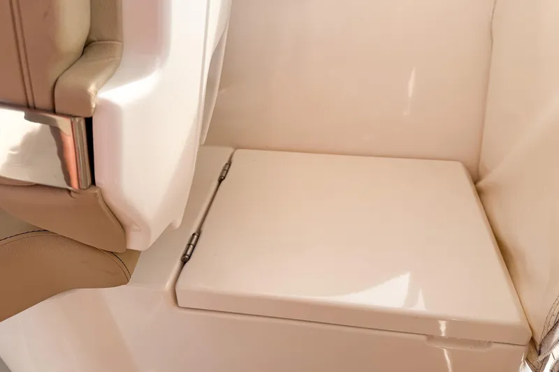 Slide: The Image of 2016 Pursuit OS 355 Offshore interior seat detail with beige upholstery and sleek design. - 21