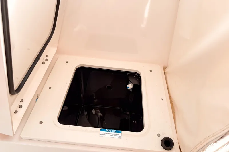 Slide: The Image of Storage compartment on 2016 Pursuit OS 355 Offshore boat, open hatch view. - 22