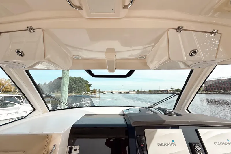 Slide: The Image of Interior view of 2016 Pursuit OS 355 Offshore boat with Garmin navigation system. - 30