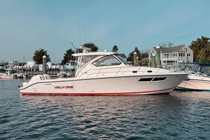 Slide: The Image of 2016 Pursuit OS 355 Offshore boat named Valkyrie docked in a marina. - 4