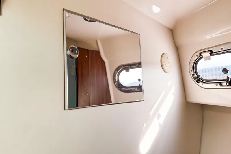 Slide: The Image of Interior of 2016 Pursuit OS 355 Offshore boat with mirror and porthole window. - 42