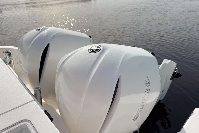 Slide: The Image of Twin Yamaha outboard engines on a 2016 Pursuit OS 355 Offshore boat. - 8