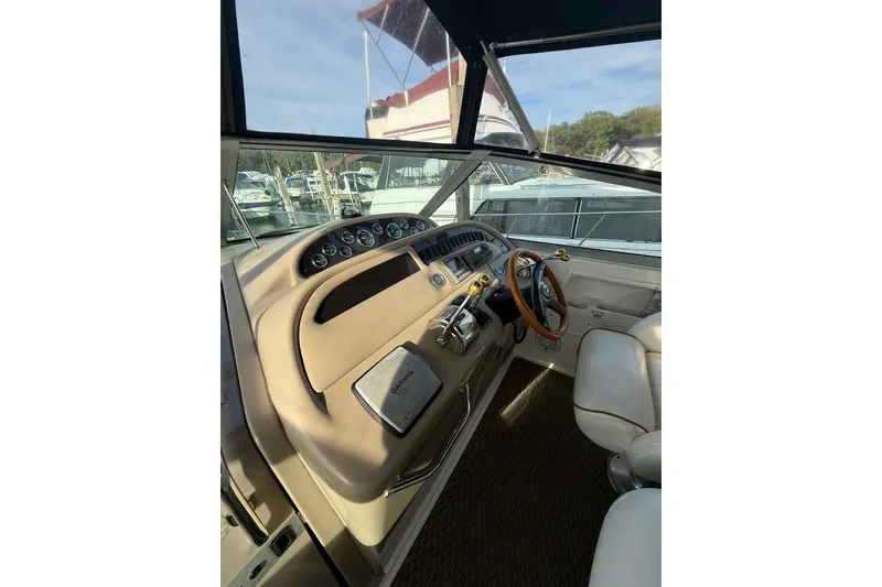 Slide: The Image of Interior helm of 2000 Sea Ray 310 Sundancer with steering wheel and controls. - 20