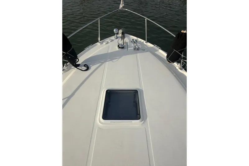 Slide: The Image of Bow view of 2000 Sea Ray 310 Sundancer on calm water. - 8