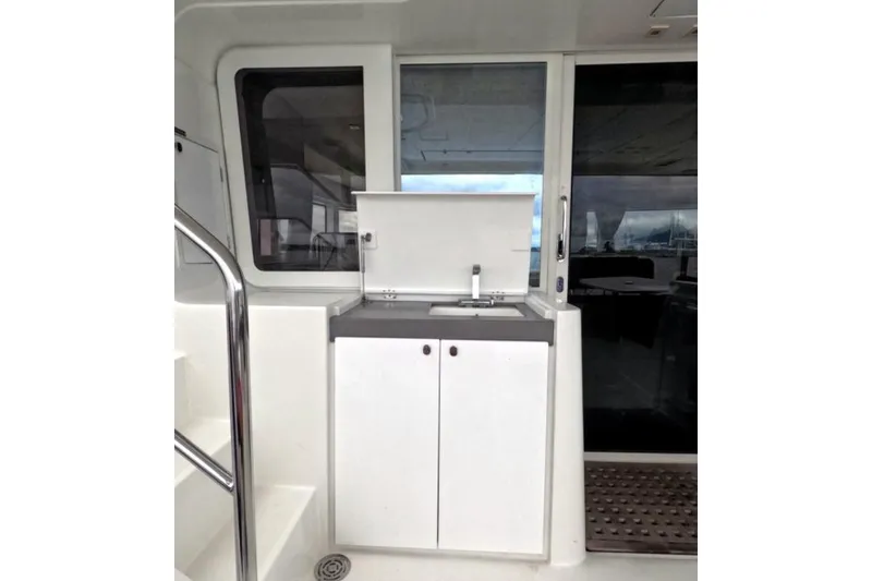 Slide: The Image of Outdoor kitchenette on 2021 Lagoon 52 F yacht with sink and storage. - 10