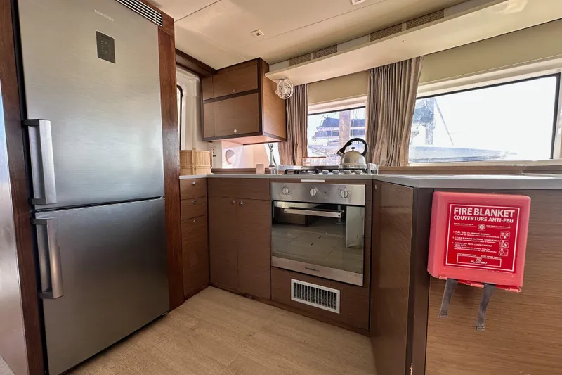 Slide: The Image of Modern kitchen interior of 2021 Lagoon 52 F yacht with stainless steel appliances. - 26