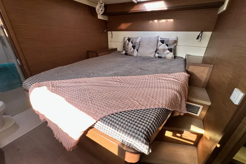 Slide: The Image of Luxurious cabin interior of 2021 Lagoon 52 F yacht with cozy bedding and modern design. - 31
