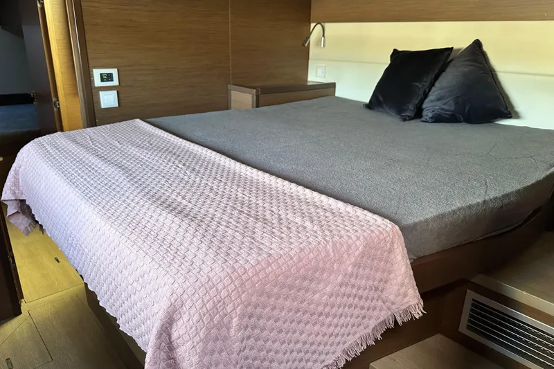 Slide: The Image of Luxurious bedroom interior of 2021 Lagoon 52 F yacht with cozy bedding and modern design. - 36