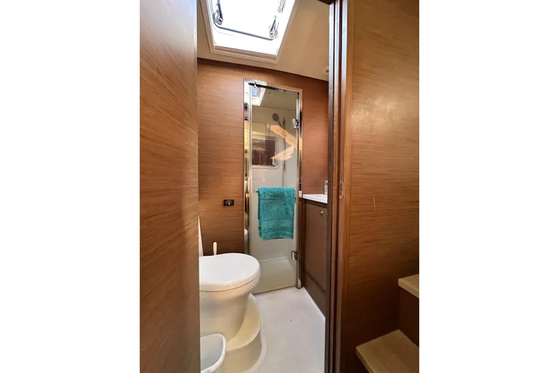 Slide: The Image of Bathroom interior of 2021 Lagoon 52 F yacht with modern fixtures and skylight. - 37