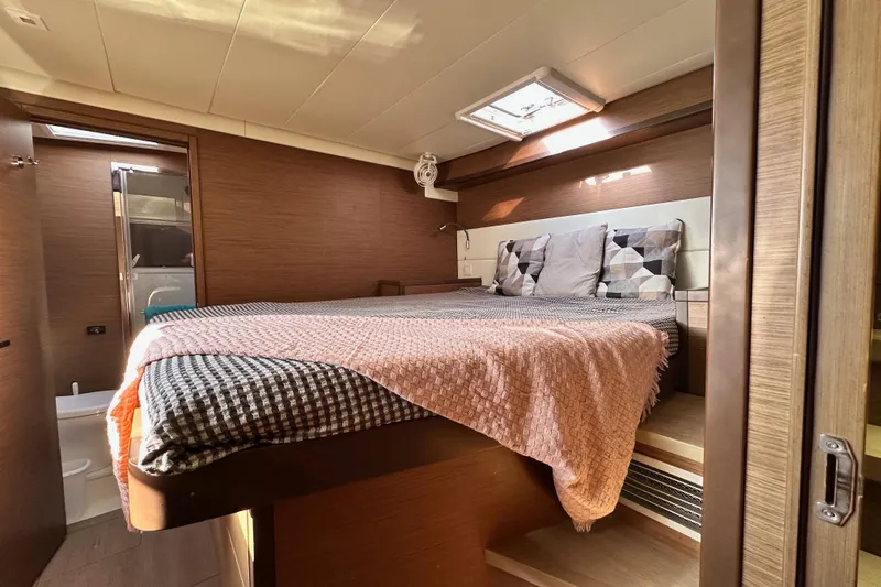 Slide: The Image of Luxurious cabin interior of 2021 Lagoon 52 F yacht with cozy bedding and modern design. - 38