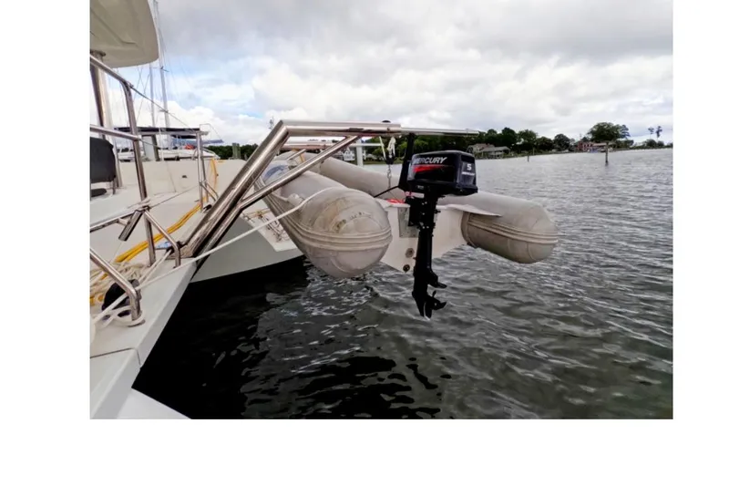 Slide: The Image of Lagoon 52 F yacht with inflatable dinghy and Mercury outboard motor, 2021 model. - 4