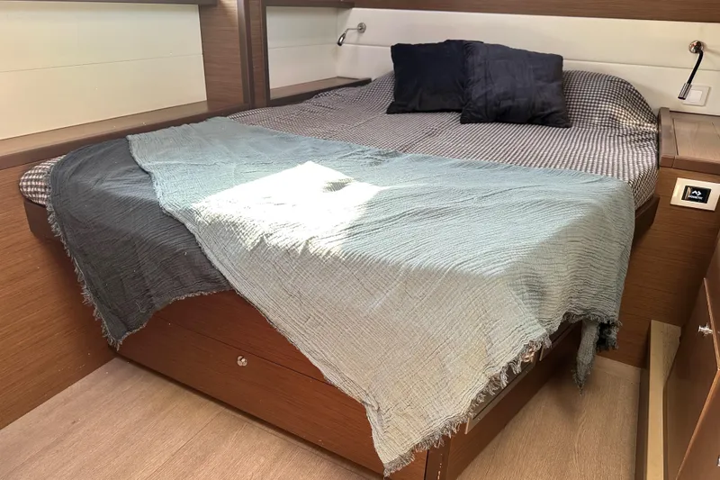 Slide: The Image of Cozy bedroom interior of 2021 Lagoon 52 F yacht with stylish bedding. - 42