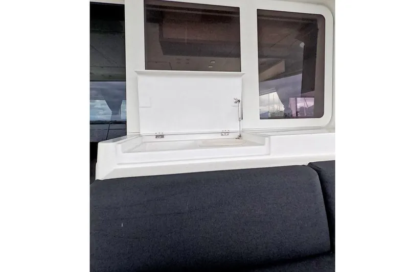 Slide: The Image of Interior view of 2021 Lagoon 52 F yacht with seating and window. - 9