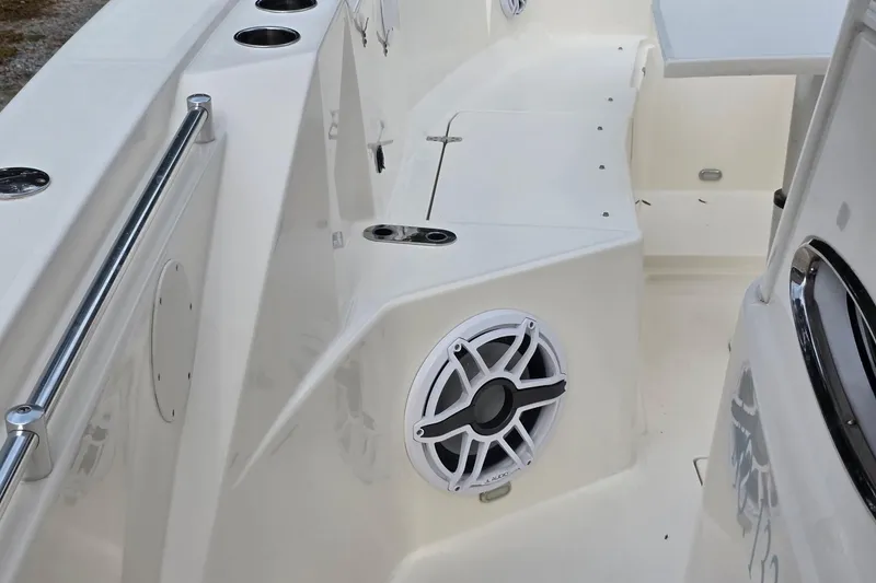 Slide: The Image of 2022 Cobia 320 Center Console boat interior with speaker and cup holders. - 10