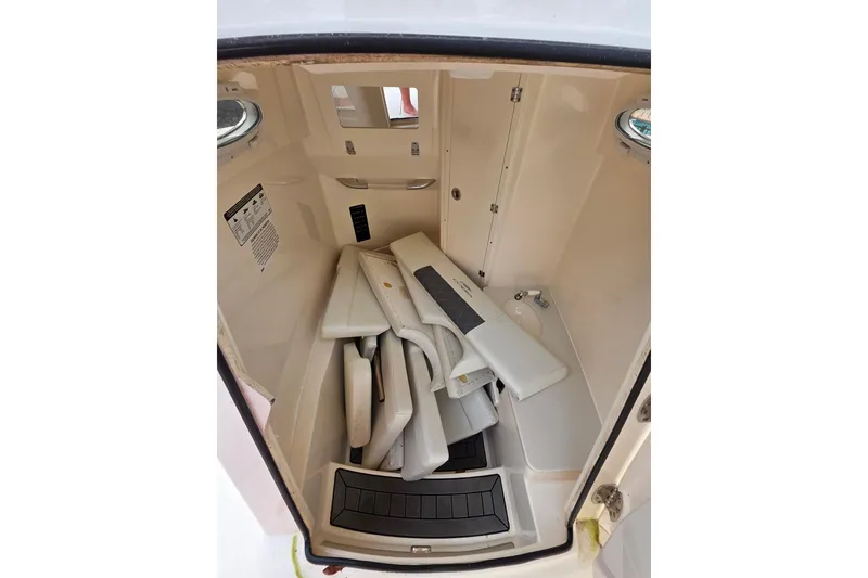 Slide: The Image of Interior view of 2022 Cobia 320 Center Console boat storage compartment. - 14