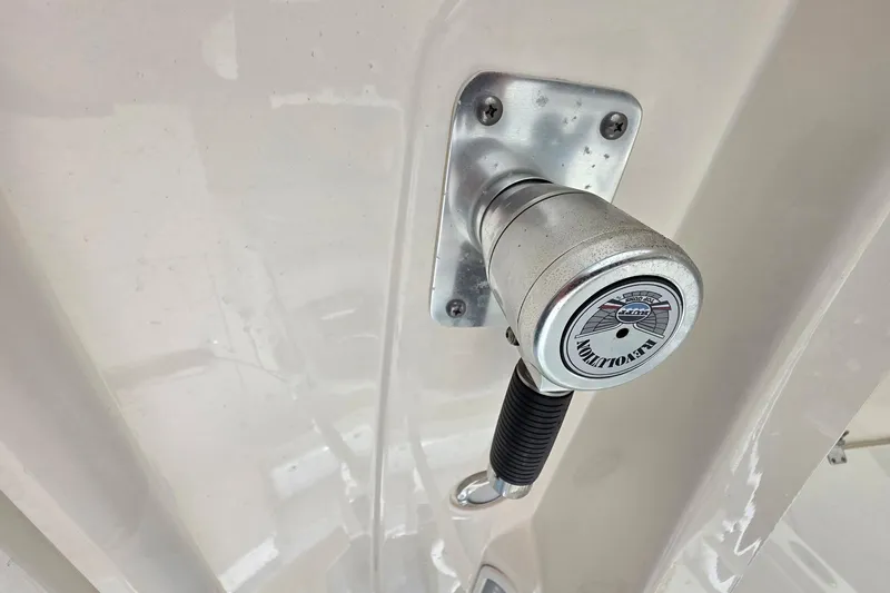 Slide: The Image of Close-up of a 2022 Cobia 320 Center Console boat handle mechanism. - 15