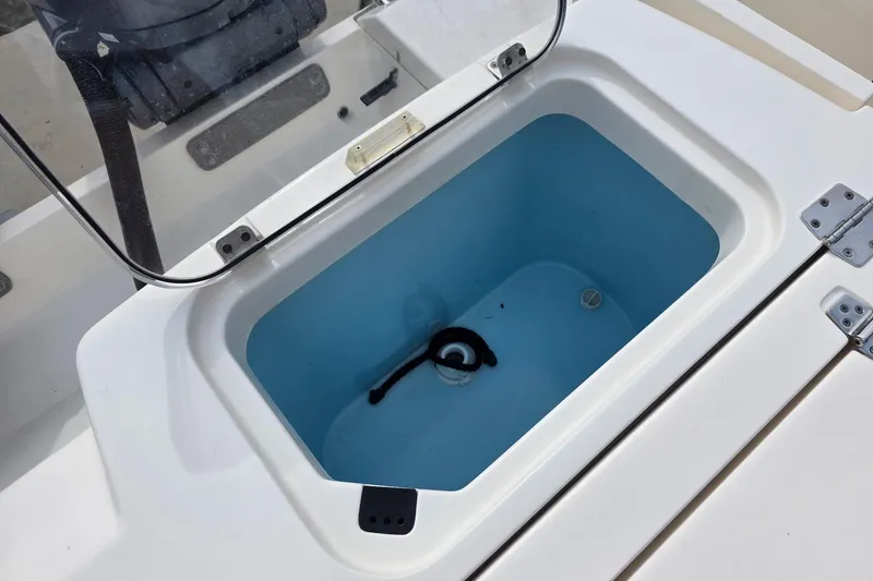 Slide: The Image of Livewell compartment on a 2022 Cobia 320 Center Console boat. - 18