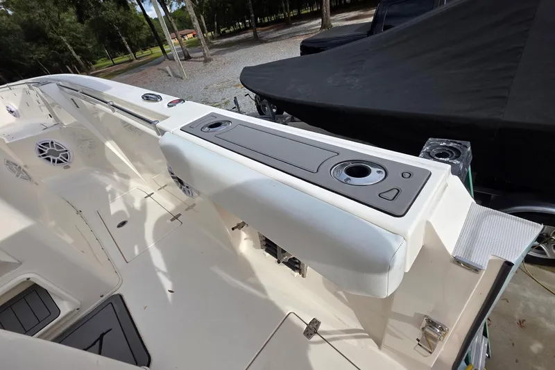 Slide: The Image of 2022 Cobia 320 Center Console boat interior with seating and storage compartments. - 26