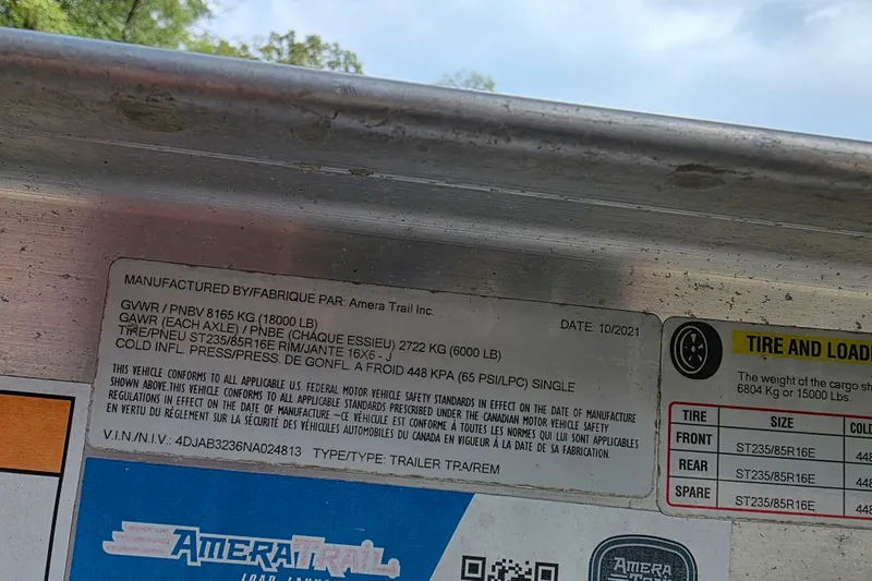 Slide: The Image of Sticker on Amera Trail trailer showing tire and load information, manufactured in October 2021. - 33
