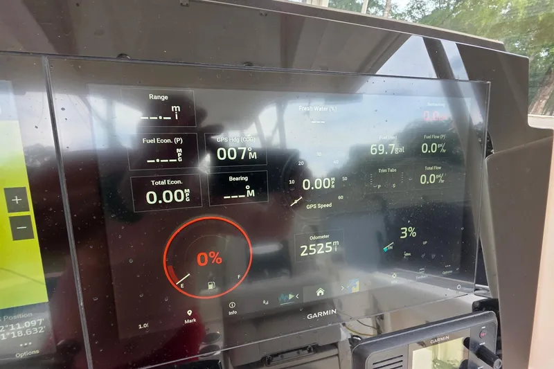 Slide: The Image of Dashboard of a 2022 Cobia 320 Center Console boat with Garmin display. - 8