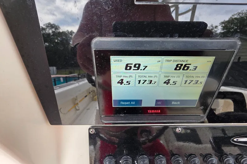 Slide: The Image of Display screen on 2022 Cobia 320 Center Console showing trip data and fuel usage. - 9