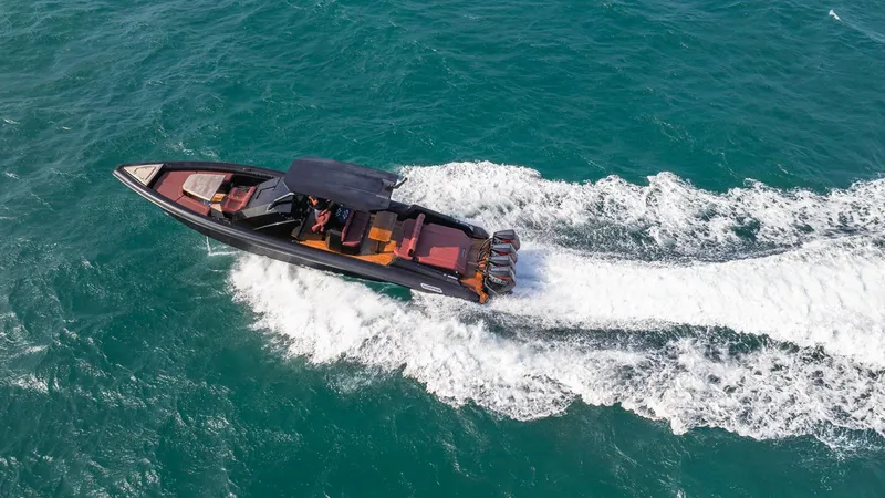 Slide: The Image of Aerial view of 2023 Skipper-BSK 42 speedboat cruising on turquoise water. - 38