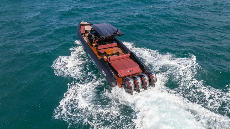 Slide: The Image of Skipper-BSK 42 boat cruising on open water, 2023 model, with powerful engines. - 11