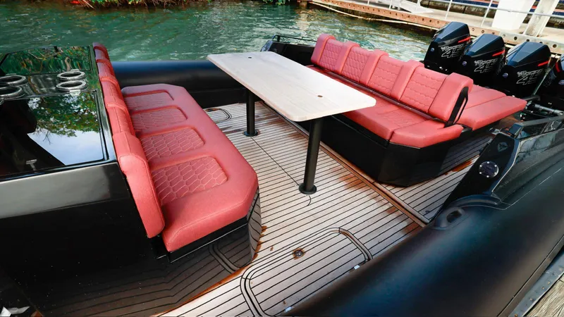 Slide: The Image of Luxurious Skipper-BSK 42 boat interior with red seating and sleek design, 2023 model. - 19