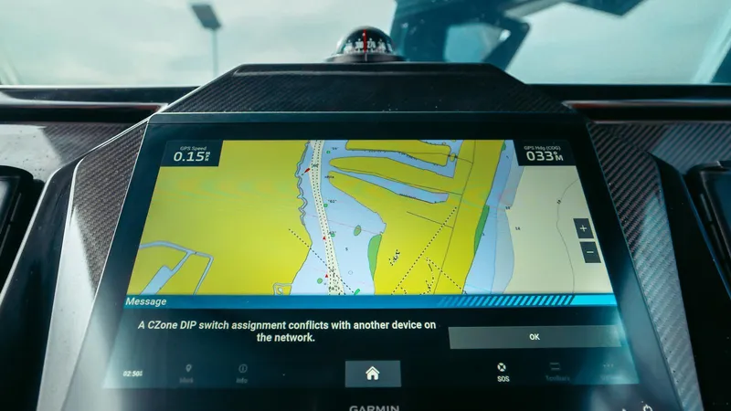 Slide: The Image of Navigation display on Skipper-BSK 42 boat, showing map and network conflict message. - 33