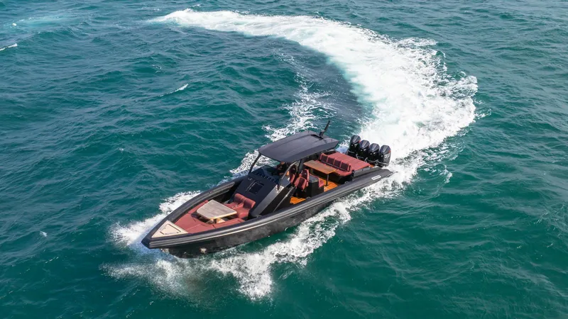 Slide: The Image of Skipper-BSK 42 boat cruising on open water, 2023 model, aerial view. - 5