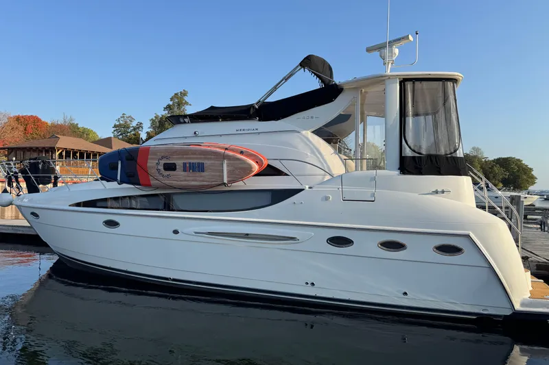 The Image of 2004 Meridian 408 Motoryacht docked with paddleboard on deck. - 0