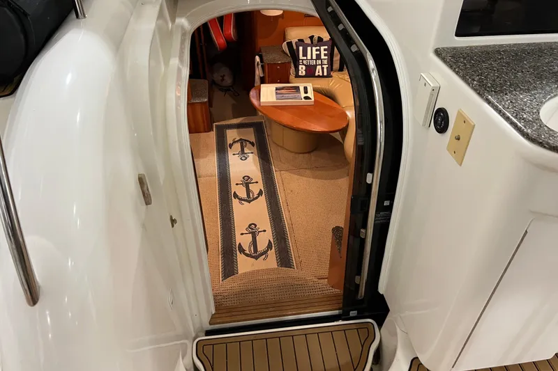 Slide: The Image of Interior view of 2004 Meridian 408 Motoryacht with nautical decor and cozy seating area. - 11