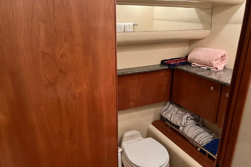 Slide: The Image of Bathroom interior of 2004 Meridian 408 Motoryacht with wooden cabinets and countertop. - 20