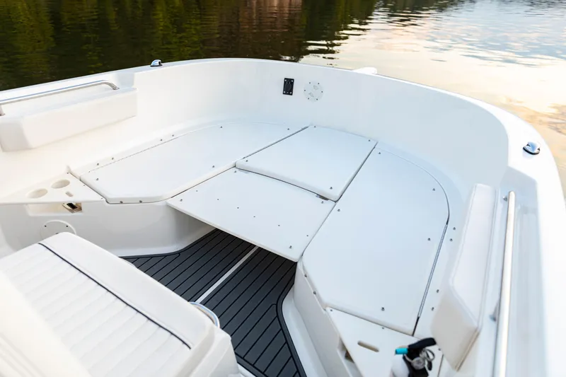 Slide: The Image of 2026 Bayliner Trophy T22CC boat interior with white seating and sleek design. - 18