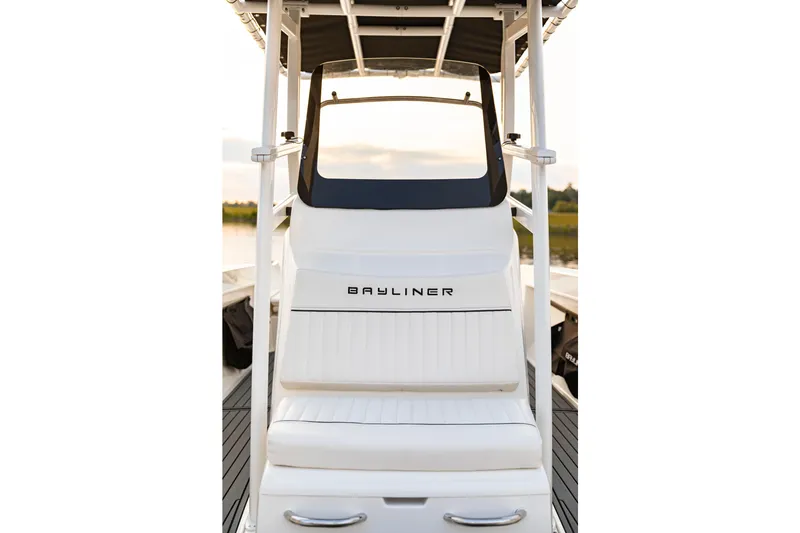 Slide: The Image of 2026 Bayliner Trophy T22CC boat interior with white seating and sleek design. - 25