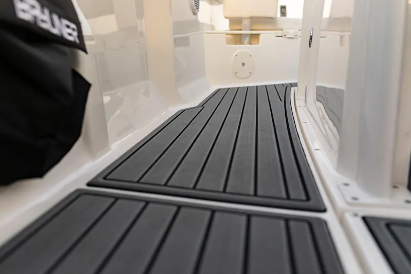 Slide: The Image of 2026 Bayliner Trophy T22CC boat deck with sleek, modern flooring design. - 30