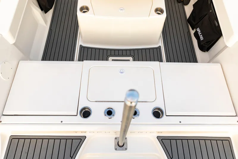 Slide: The Image of 2026 Bayliner Trophy T22CC boat deck with sleek design and cup holders. - 32