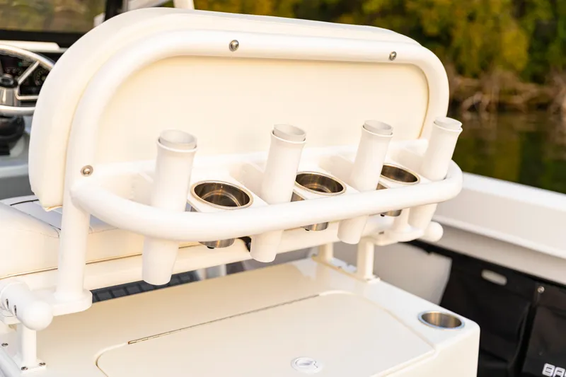Slide: The Image of 2026 Bayliner Trophy T22CC boat with rod holders and storage compartment. - 34