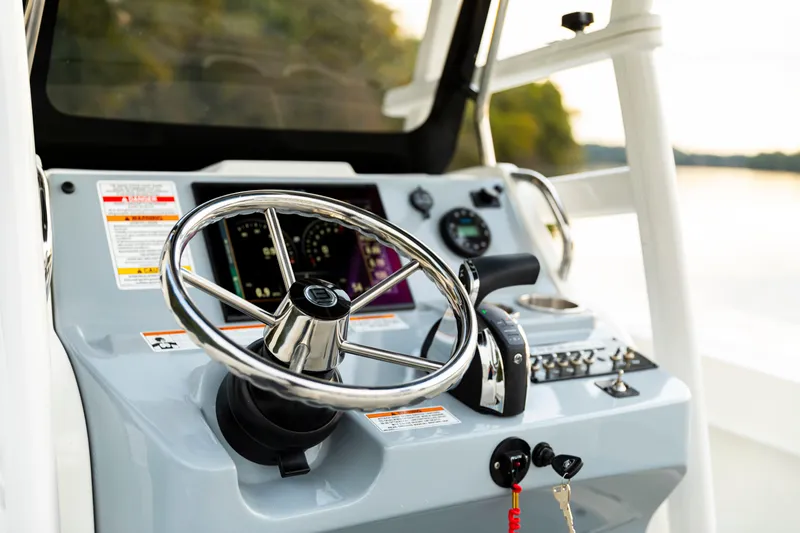 Slide: The Image of Steering console of 2026 Bayliner Trophy T22CC boat with modern controls. - 43
