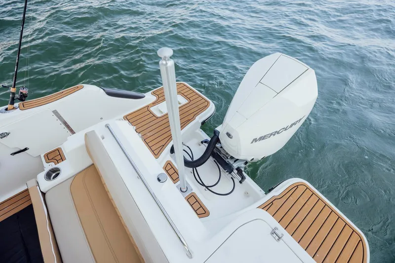 Slide: The Image of 2026 Bayliner Trophy T22SC boat with Mercury outboard motor on water. - 20