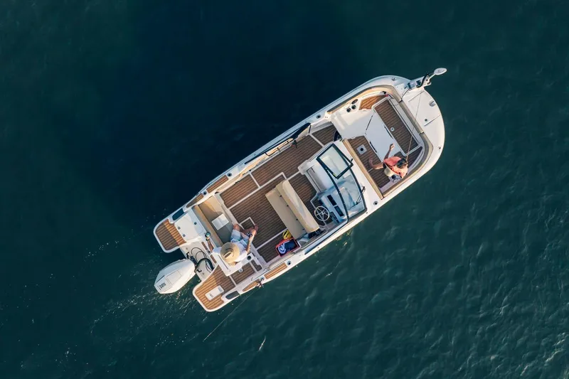 Slide: The Image of Aerial view of 2026 Bayliner Trophy T22SC boat on open water. - 31