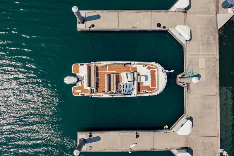 Slide: The Image of Overhead view of 2026 Bayliner Trophy T22SC docked at marina. - 7