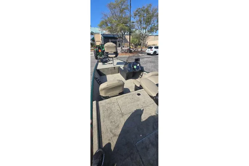 Slide: The Image of 2026 Tracker Bass Tracker Classic Limited boat interior with seating and steering console. - 3